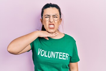 Sticker - Young hispanic woman wearing volunteer t shirt cutting throat with hand as knife, threaten aggression with furious violence