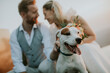 © BGStock72 - Young newlywed couple with their Jack Russel Terrier dog
