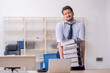 © Elnur - Young male employee and too much work in the office