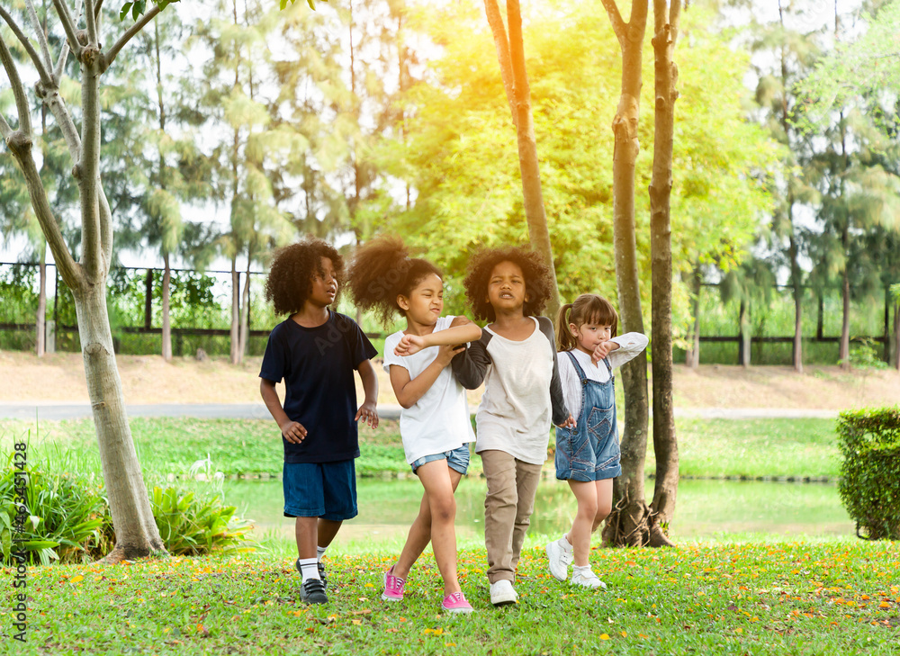 Group of diversity kids playing cheerful in the park. Children having ...