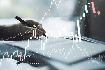 Double exposure of abstract creative financial diagram with hand writing in notebook on background, banking and accounting concept