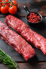 Wall Mural - Raw denver steak or organic top blade with herbs on old wooden planks surface side view vertical close up