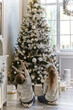 © Inna Vlasova - Little brother and sister look at a beautiful decorated Christmas tree