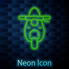 Sticker - Glowing neon line Scooter icon isolated on brick wall background. Vector