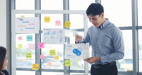 Poster - Happy business people meeting present graph chart investment, business data in meeting room. Group of business people meeting in conference room. Asian businessman speech, present teamwork partnership