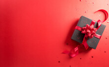 Online Shopping Of China, 11.11 Singles Day Sale Concept. Top View Of Black Christmas Gift Boxes With Star On Red Background With Copy Space.