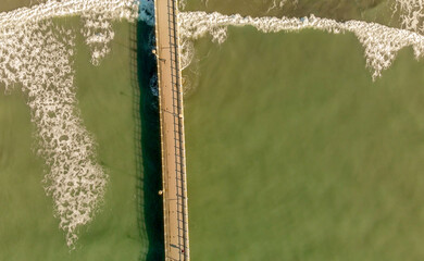 Wall Mural - Pier over the beautiful ocean, view from drone