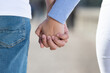 © Egoitz - Closeup of young couple holding hands.