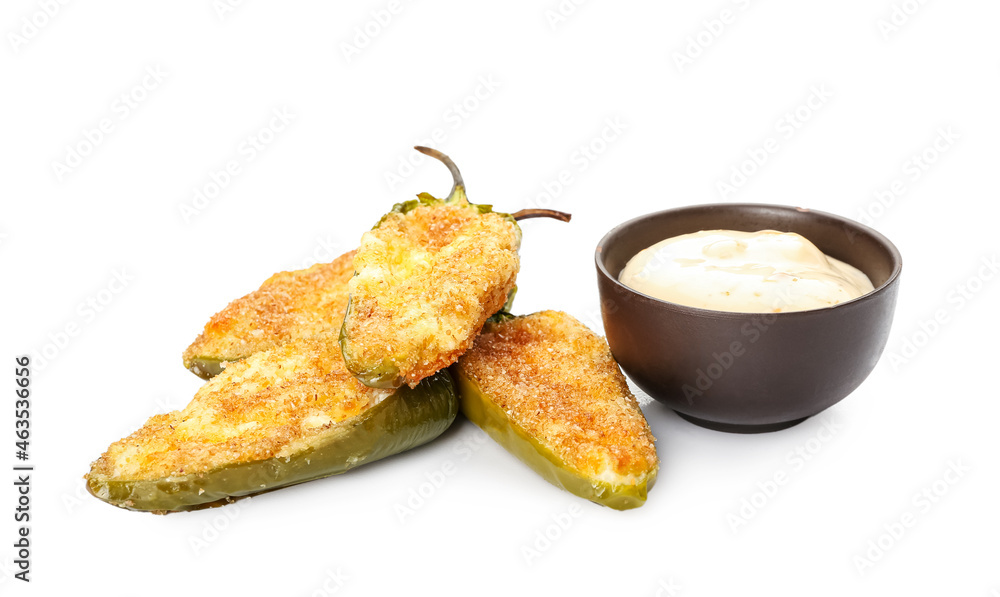 Delicious jalapeno poppers and sauce on white background