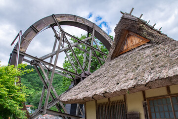 夢すき公園の親子孫水車　岡山県新見市神郷 The largest triad waterwheel in Japan (parent-child-grandchild waterwheel)  and old Japanese-style house at Yumesuki Park in Shingo town, Niimi city, Okayama pref. Japan.