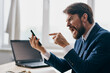 © SHOTPRIME STUDIO - businessmen sitting at a desk in front of a laptop stress anger professional