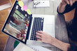 © vectorfusionart - Hands of man using laptop for video call, with high school pupil on screen
