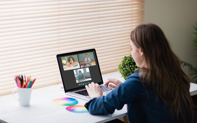 Sticker - Caucasian girl using laptop for video call, with smiling diverse elementary school pupils on screen