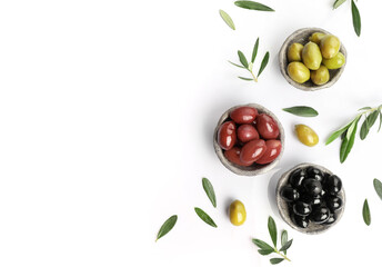 Poster - Green, red and black olives in bowls isolated on white background