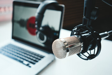 Wall Mural - Podcast studio interior. Microphone, laptop and cozy streaming workplace, close-up