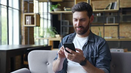 Wall Mural - happy young caucasian business man freelancer using mobile phone device