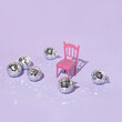 © Adela - Christmas creative layout with disco ball Christmas baubles and pastel pink chair on pastel purple background. 80s or 90s aesthetic fashion party concept. Minimal New Year decoration  idea.