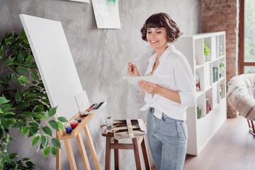 Sticker - Photo portrait woman wearing white shirt creating painting spending free time at home