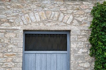 Poster - Closeup of an abandoned house with an old entrance door