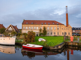 Wall Mural - Former ice skate factory Nooitgedagt on Geeuw canal in IJlst, Friesland, Netherlands