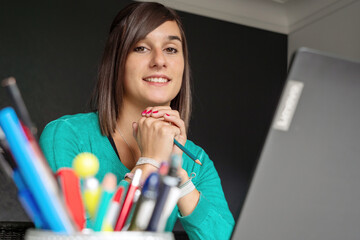 Wall Mural - Portrait of a young brunette woman smiling