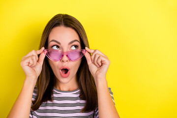 Canvas Print - Photo of cool millennial brunette lady look empty space wear eyewear white t-shirt isolated on yellow background