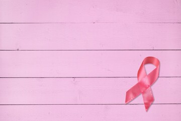 Wall Mural - Pink ribbon on pastel background, Breast cancer awareness concept