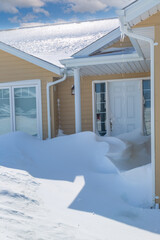 Wall Mural - Snow piled into a doorway after a snowstorm.