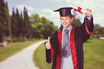 Portrait of handsome male graduate in a graduation robe