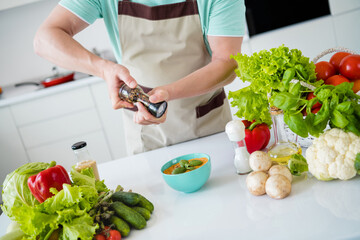 Sticker - Cropped photo of man hands spice tasty meal hold pepper box wear kitchenware apron in kitchen apartment indoors