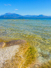 Canvas Print - Sirmione beach with Lake Garda