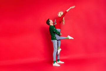 Sticker - Full length body size photo boyfriend keeping overjoyed happy girlfriend laughing isolated vivid red color background