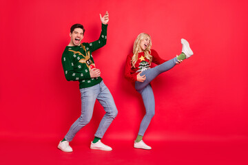 Sticker - Full length body size photo dancing people laughing in ugly jumpers imagine playing guitar isolated vivid red color background