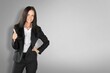 © BillionPhotos.com - Wow really not bad, good choice. Impressed woman stand on background