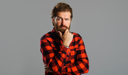 Sticker - Pensive bearded man in plaid shirt. Thoughtful Handsome male. Solution of problem.