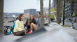 © Martin Barraud/Caia Image - Happy young women talking in city park