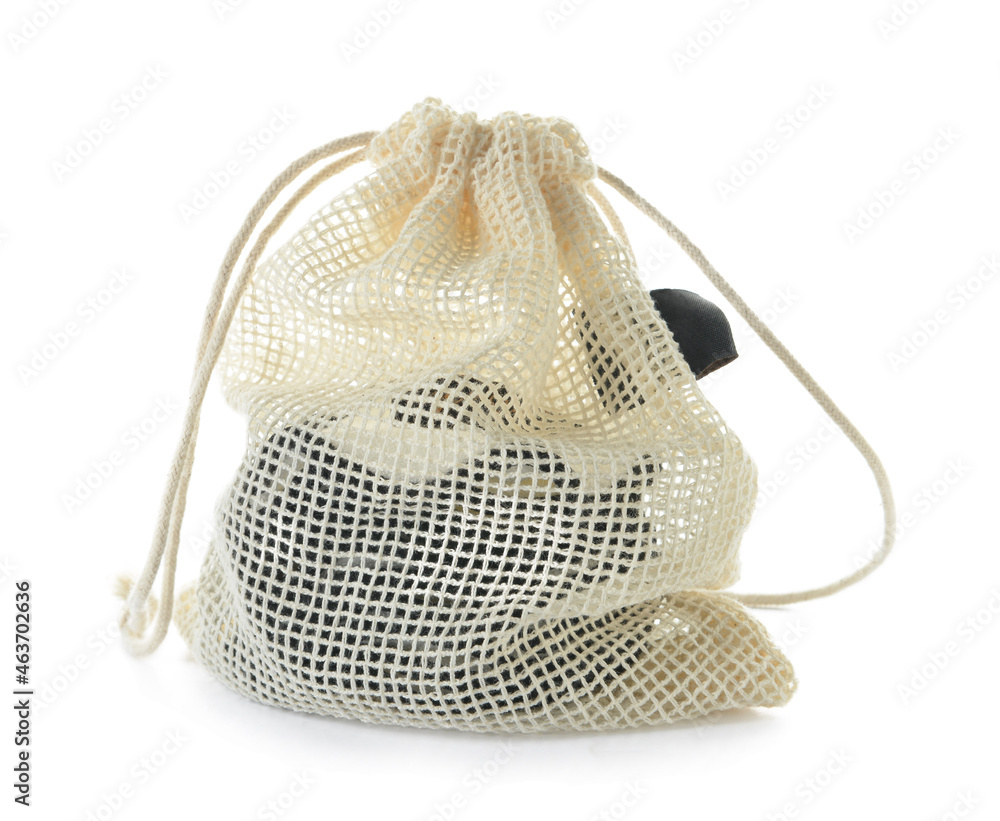 Bag with reusable cotton pads on white background