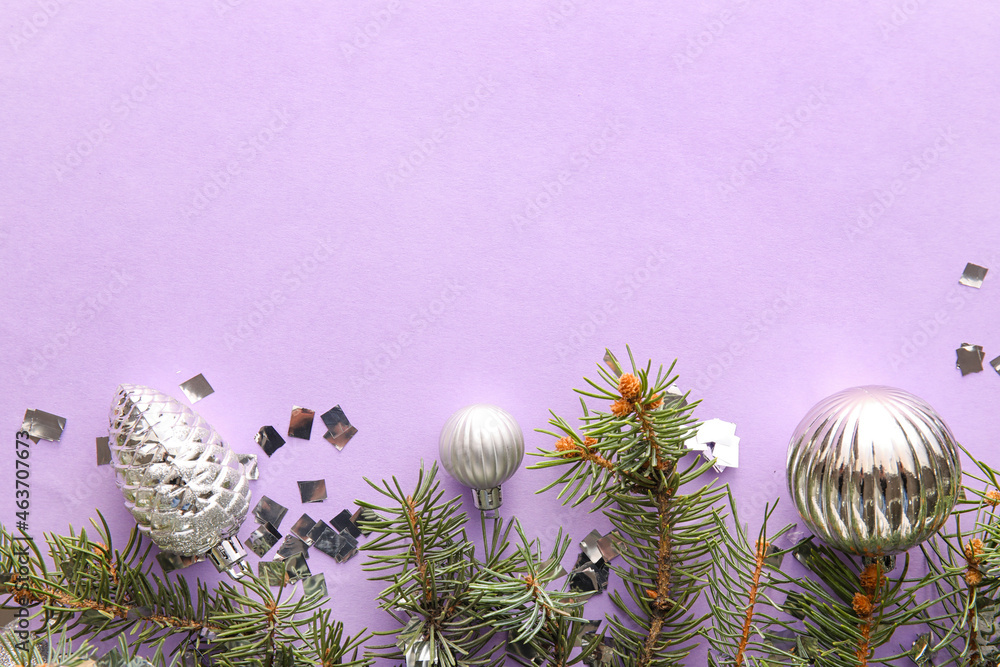 Composition with fir branches and Christmas decorations on lilac background, closeup