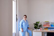 © ALTO IMAGES/Stocksy - Woman with Down syndrome in workspace