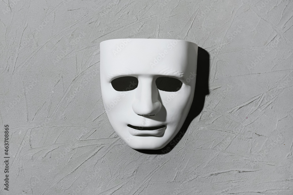 Guy Fawkes mask on grunge background