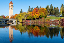 Spokane River Reflecting A Colorful Riverfront Park During Autumn In Downtown Spokane, WA