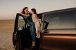© Eloisa Ramos/Stocksy - Family traveling by van resting at rest area