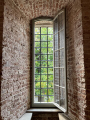 Wall Mural - Closeup shot of a long window on the building with bricks