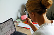 © Danil Nevsky/Stocksy - Woman paying taxes via netbook