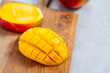 © Pietro Karras/Stocksy - Cut diced mango