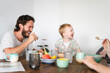 © Mal de Ojo Studio/Stocksy - Family having breakfast together