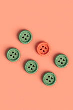 Top-down View Of  Buttons On Pink Background