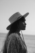 Profile Portrait Of Woman With Sun Hat