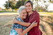 © Erin Brant/Stocksy - Tender moment between woman and elderly mom
