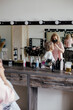 © Sergey Narevskih/Stocksy - Beautician applying makeup to senior female customer